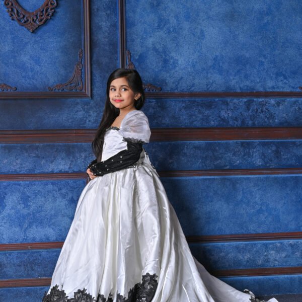 Regal Grace: Ivory Satin Ball Gown with Black Lace Detailing